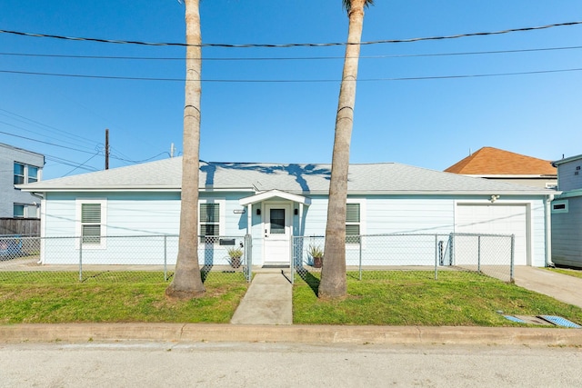 view of front of home featuring a front yard, driveway, a garage, and a fenced front yard