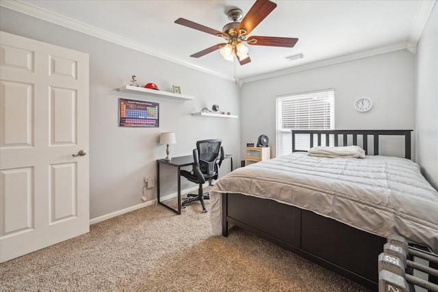 carpeted bedroom featuring visible vents, a ceiling fan, baseboards, and ornamental molding