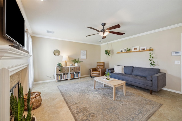 living room featuring ceiling fan, a fireplace, crown molding, and baseboards