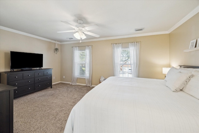 carpeted bedroom featuring ceiling fan, baseboards, visible vents, and ornamental molding