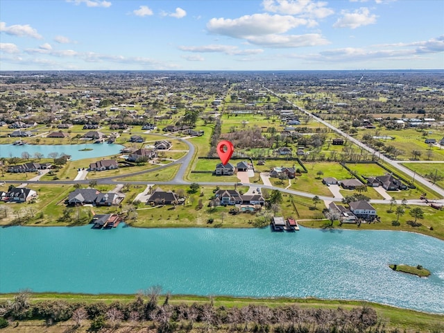 bird's eye view featuring a water view and a residential view