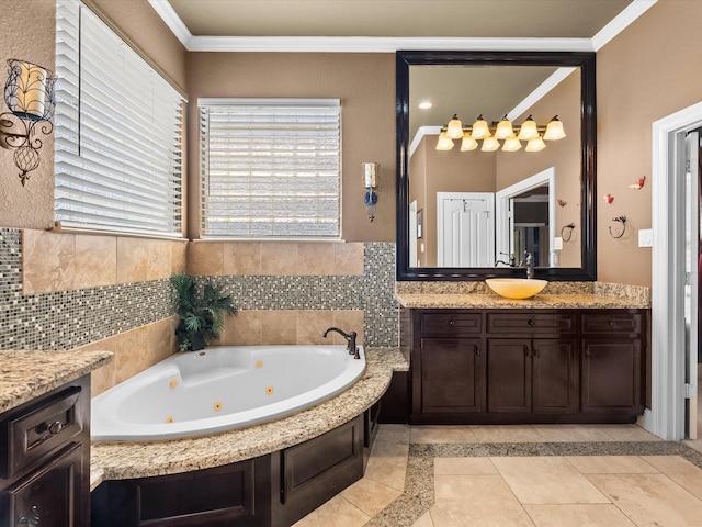 full bath featuring tile patterned floors, vanity, ornamental molding, and a tub with jets