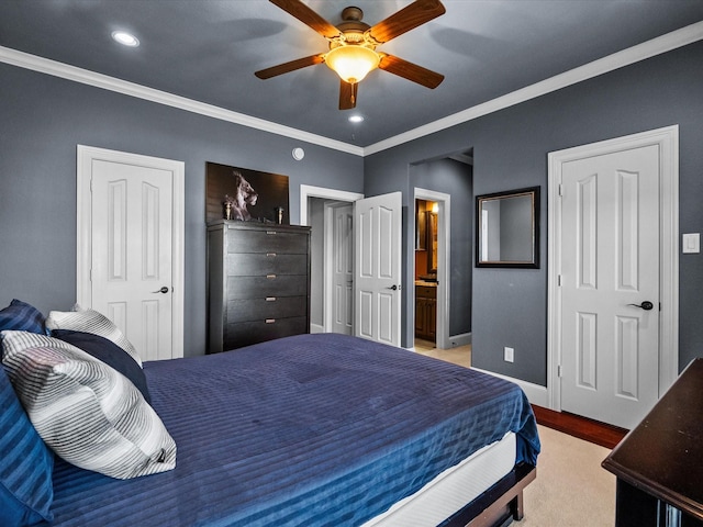 bedroom with ensuite bath, recessed lighting, crown molding, baseboards, and ceiling fan