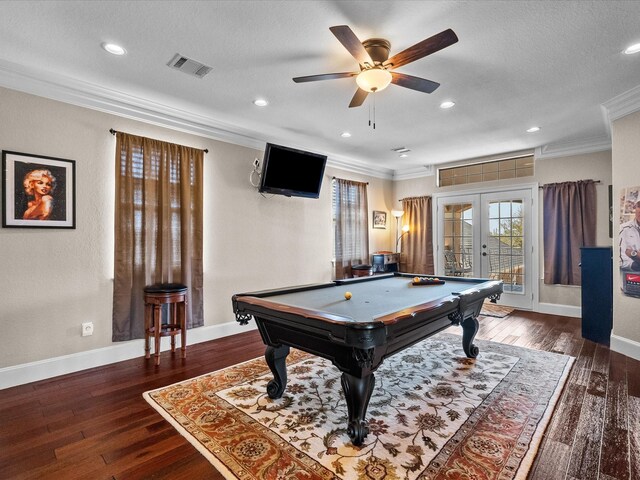 game room featuring visible vents, baseboards, ornamental molding, hardwood / wood-style floors, and french doors