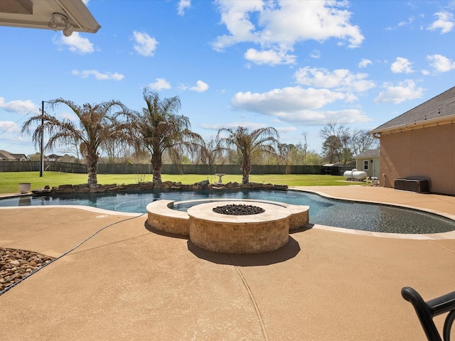 pool with a patio area, a fenced backyard, and a yard