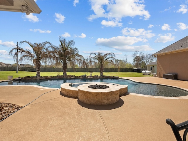 pool with a fire pit, a yard, and a patio area