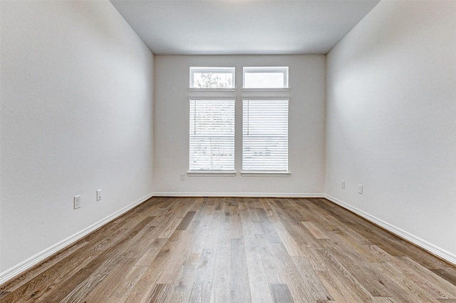 30715 Parkside Passage Dr, Fulshear, TX 77441 - spare room featuring wood finished floors and baseboards