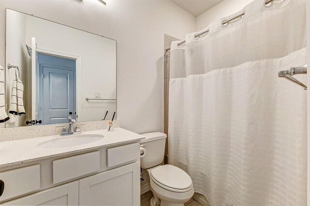 30715 Parkside Passage Dr, Fulshear, TX 77441 - bathroom with toilet, vanity, and a shower with curtain