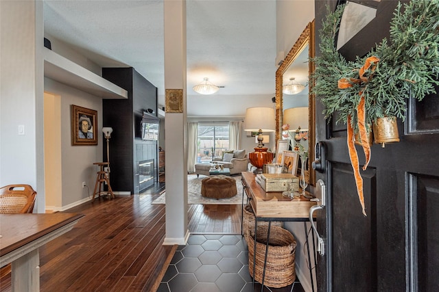 interior space with dark wood finished floors and baseboards