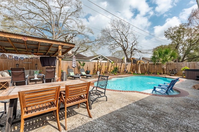 view of swimming pool featuring a fenced in pool, a patio, outdoor dining area, and a fenced backyard