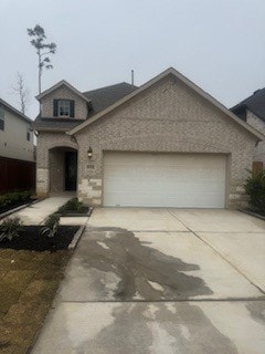 view of front of property with a garage and driveway