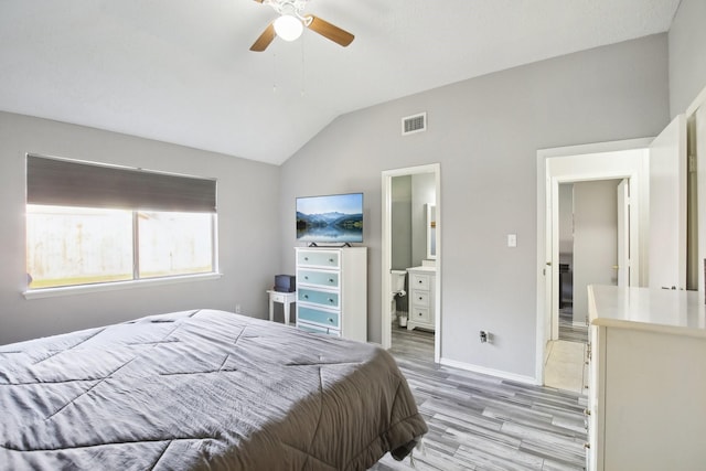 bedroom with a ceiling fan, baseboards, visible vents, vaulted ceiling, and light wood-type flooring