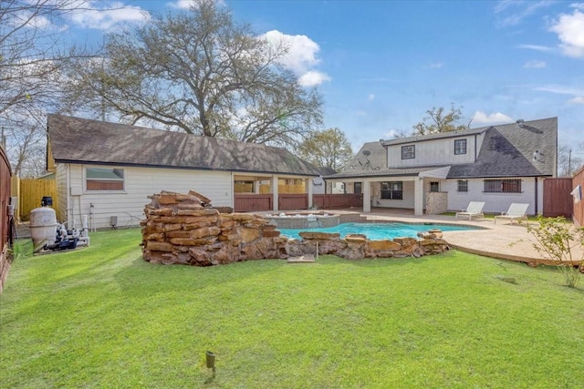 back of property with a fenced in pool, an in ground hot tub, a yard, a fenced backyard, and a patio area