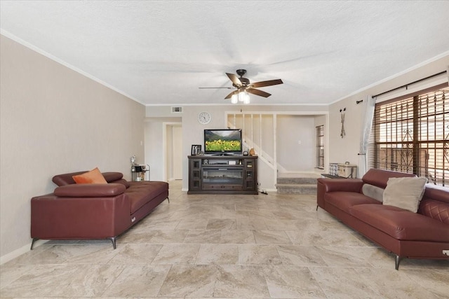 living area with a textured ceiling, stairway, crown molding, baseboards, and ceiling fan