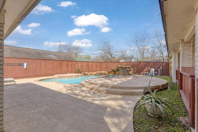 view of pool featuring a patio area, a fenced in pool, and a fenced backyard