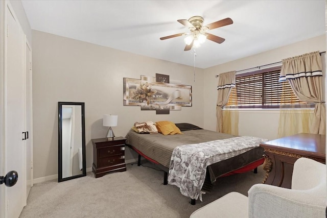 bedroom featuring carpet flooring, a ceiling fan, and baseboards