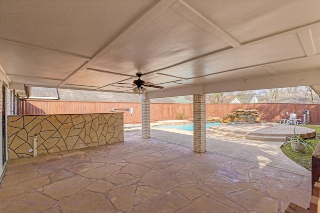 view of patio / terrace featuring a fenced in pool, a ceiling fan, and a fenced backyard