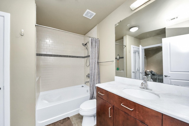 full bathroom featuring vanity, toilet, visible vents, and shower / tub combo with curtain