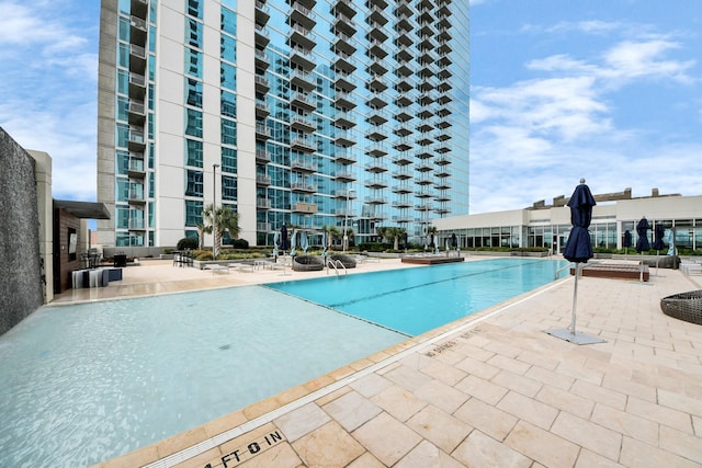 view of swimming pool featuring a patio