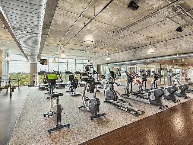 exercise room with wood finished floors