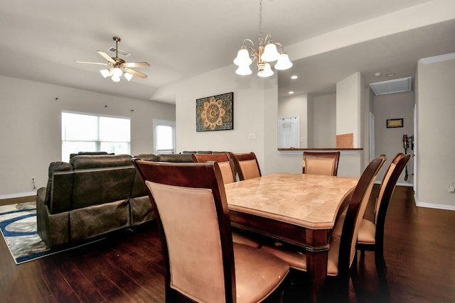 dining room featuring dark wood finished floors, visible vents, ceiling fan with notable chandelier, and baseboards