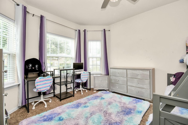 carpeted bedroom with baseboards and ceiling fan