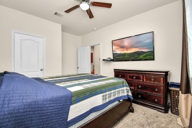 bedroom featuring visible vents, carpet flooring, and a ceiling fan