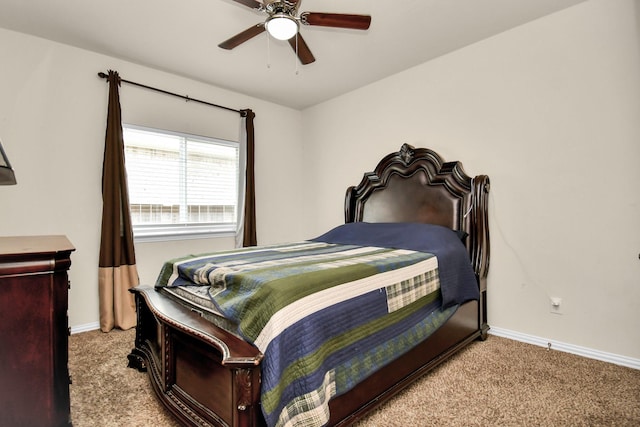 bedroom featuring a ceiling fan, baseboards, and carpet floors