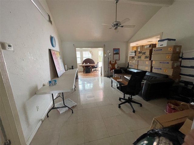 tiled home office featuring baseboards, high vaulted ceiling, and a ceiling fan