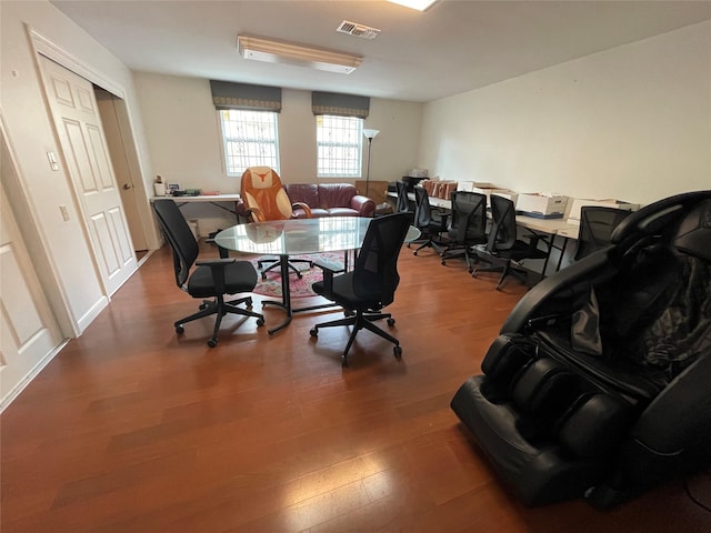 office area featuring visible vents and wood finished floors