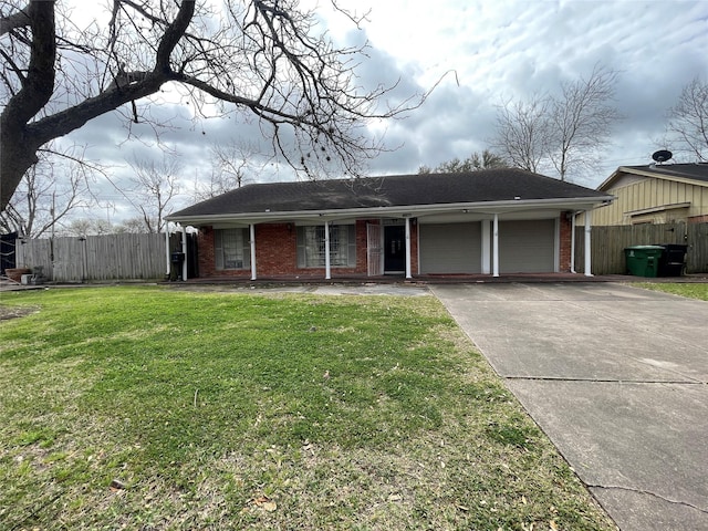 ranch-style home featuring brick siding, driveway, a front lawn, and fence