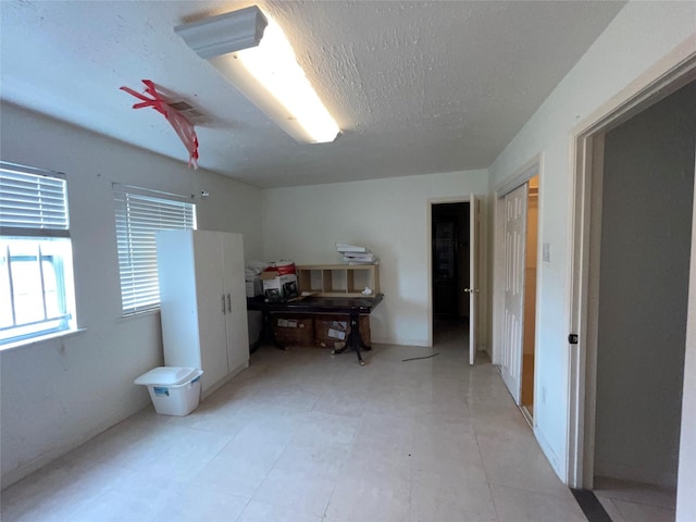 interior space featuring a textured ceiling