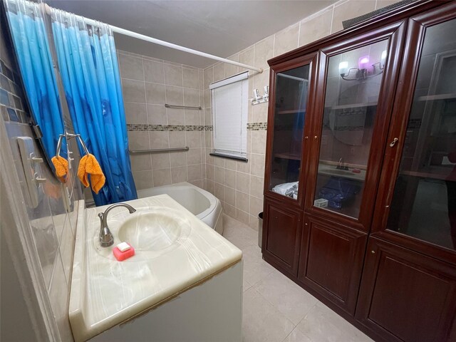 bathroom with vanity, a shower with curtain, tile patterned flooring, tile walls, and toilet