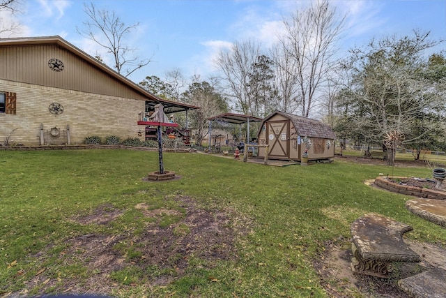 view of yard with a storage shed and an outbuilding