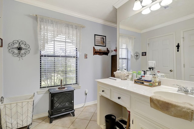 bathroom with visible vents, baseboards, crown molding, and tile patterned flooring