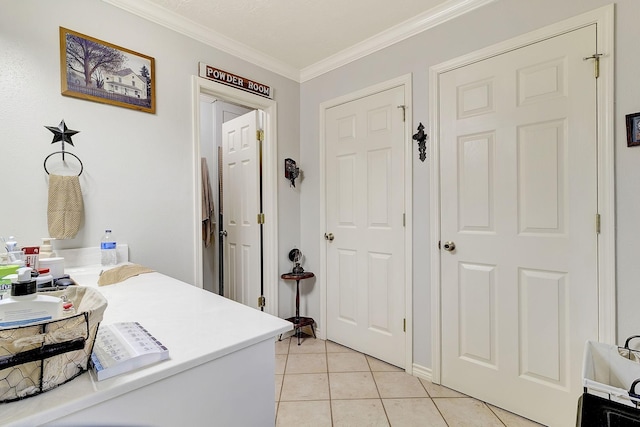 interior space with crown molding and light tile patterned floors