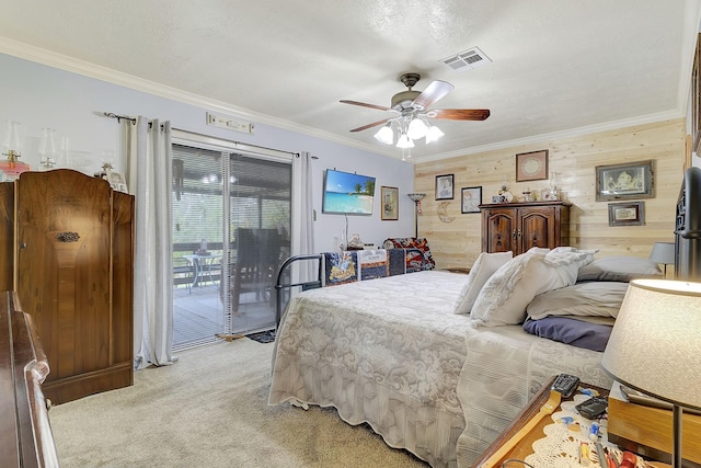 bedroom featuring a ceiling fan, visible vents, ornamental molding, access to exterior, and light carpet