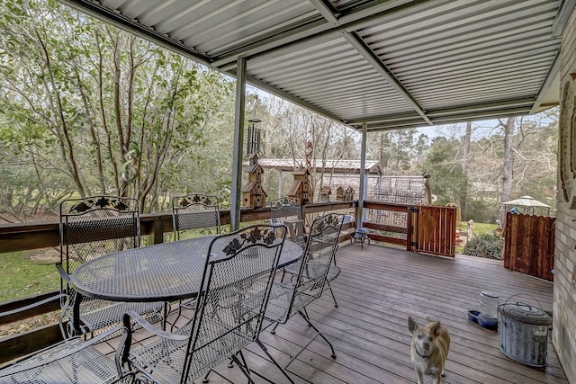 wooden terrace featuring outdoor dining space