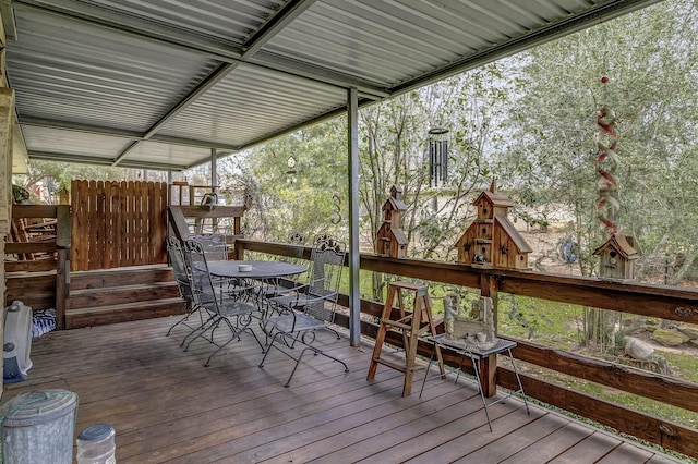 wooden deck with outdoor dining space