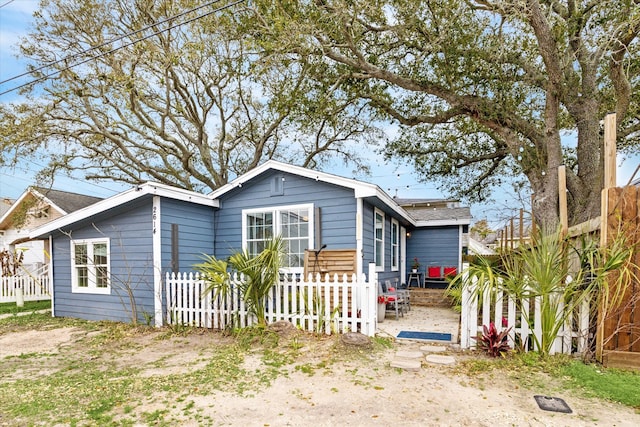 view of front of house with fence