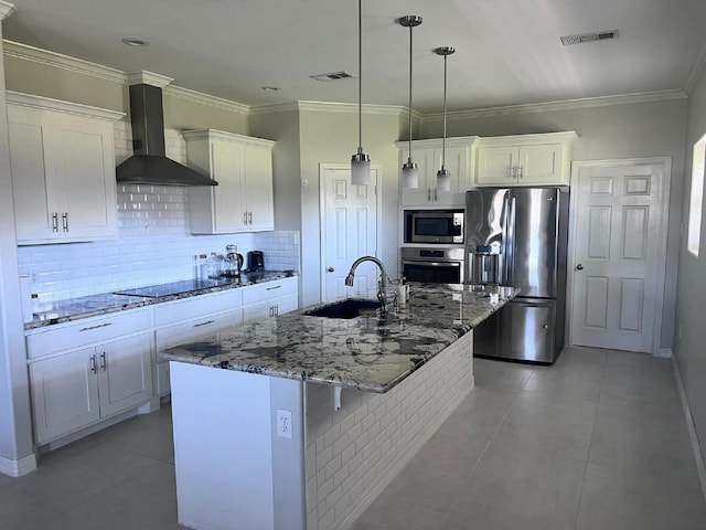 kitchen featuring a sink, wall chimney exhaust hood, visible vents, and stainless steel appliances