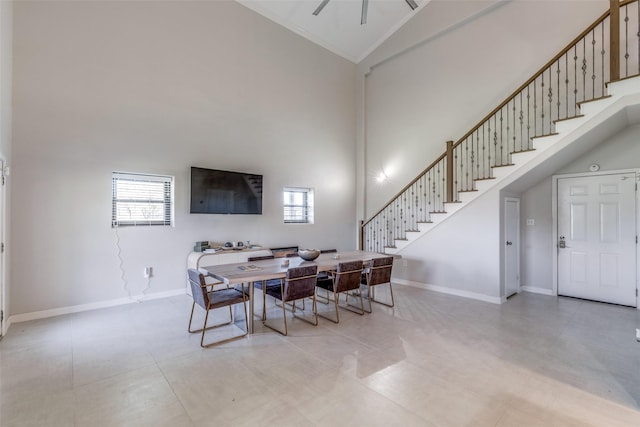10711 Hidden Lake Ln, Richmond, TX 77406 - dining room featuring stairs, plenty of natural light, high vaulted ceiling, baseboards, and a ceiling fan