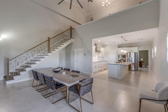 10711 Hidden Lake Ln, Richmond, TX 77406 - dining area featuring stairway, baseboards, a towering ceiling, light tile patterned floors, and crown molding