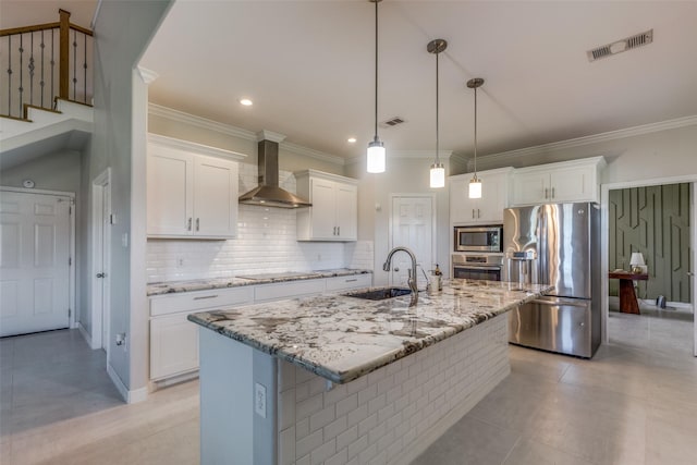 10711 Hidden Lake Ln, Richmond, TX 77406 - kitchen featuring appliances with stainless steel finishes, a sink, wall chimney range hood, white cabinets, and crown molding