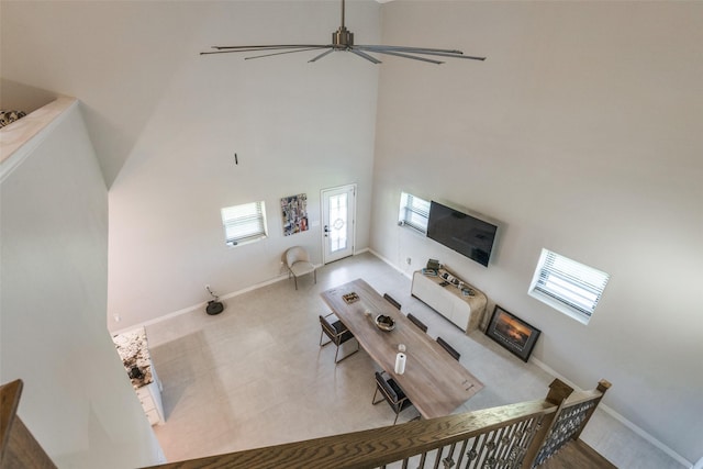 10711 Hidden Lake Ln, Richmond, TX 77406 - living room with a high ceiling, baseboards, and ceiling fan