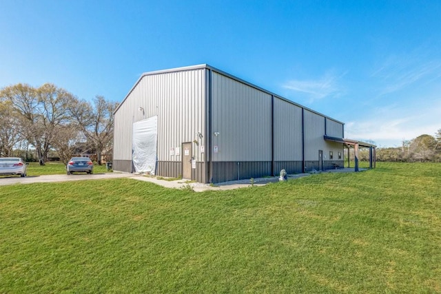 10711 Hidden Lake Ln, Richmond, TX 77406 - view of pole building featuring a lawn and driveway
