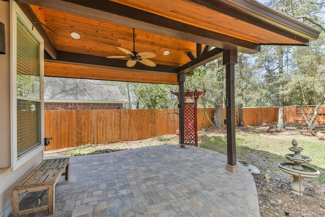 view of patio featuring fence private yard and ceiling fan