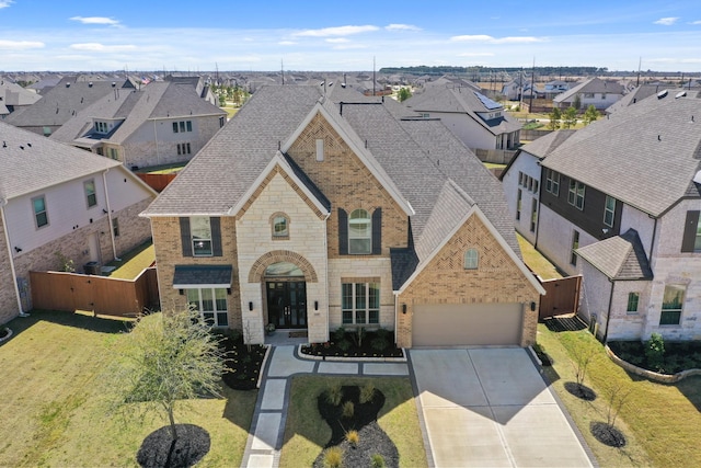 view of front of home featuring brick siding, a residential view, and a shingled roof