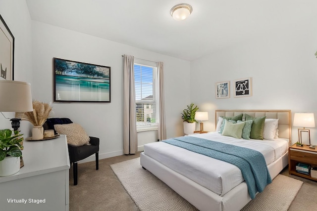 carpeted bedroom with baseboards