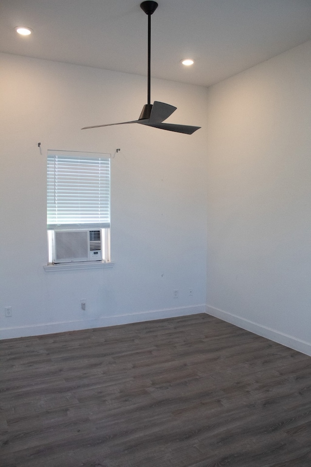 empty room featuring recessed lighting, cooling unit, baseboards, and dark wood-style flooring